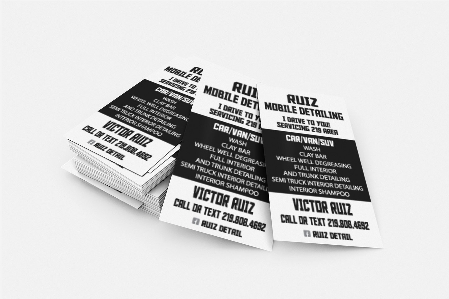 Stack of business cards for Rulz Mobile Detailing on a white background