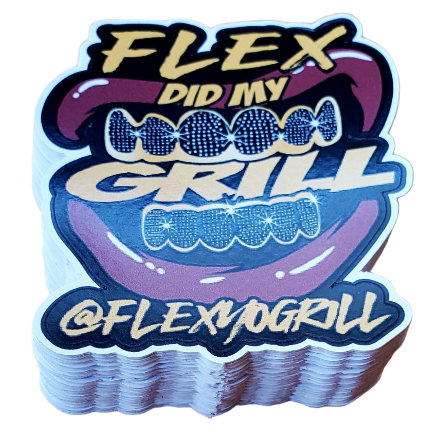 Stack of 'Flex Did My Grill' stickers on a wooden surface