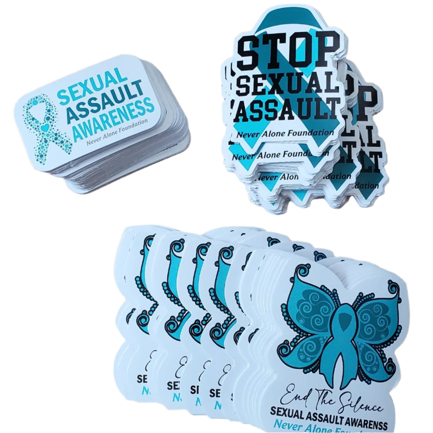Stack of stickers with sexual assault awareness design on a wooden surface
